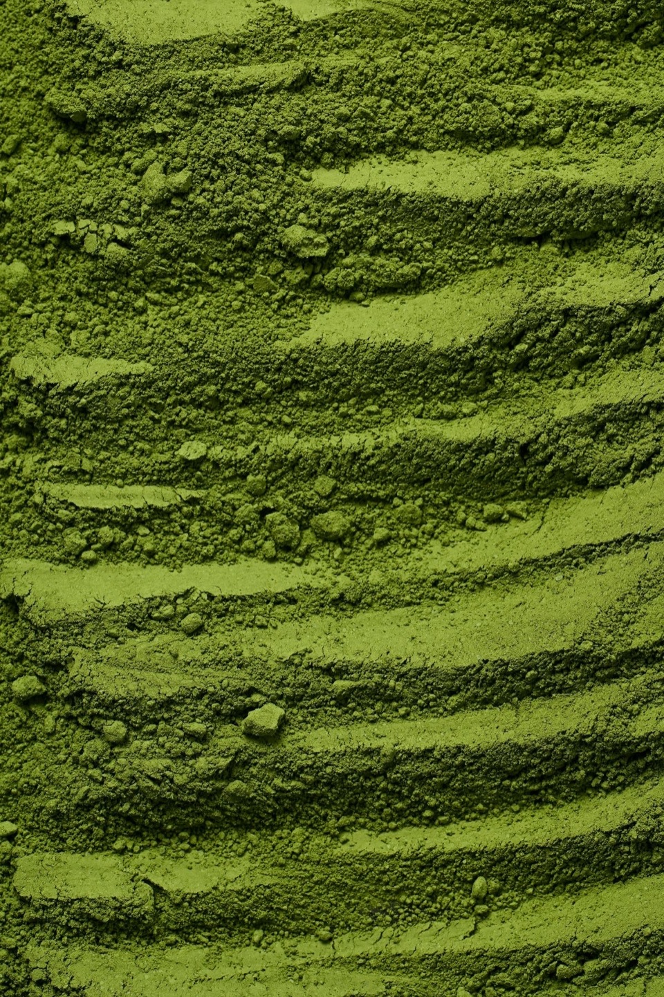Macro photograph of vivid green sēn matcha powder