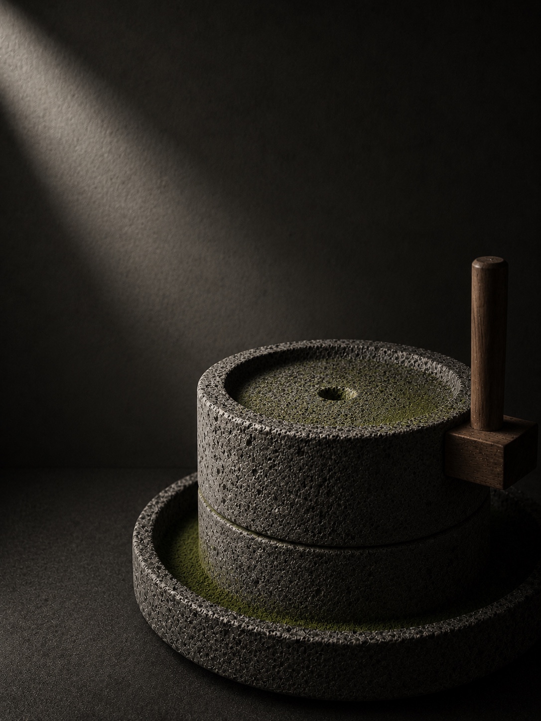 Stone mill used to slowly grind matcha, one turn at a time